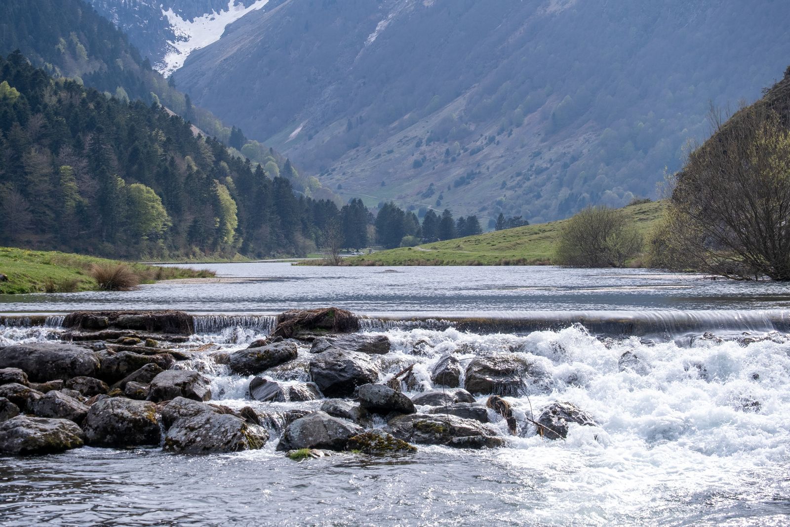 River cascading through a green valley
