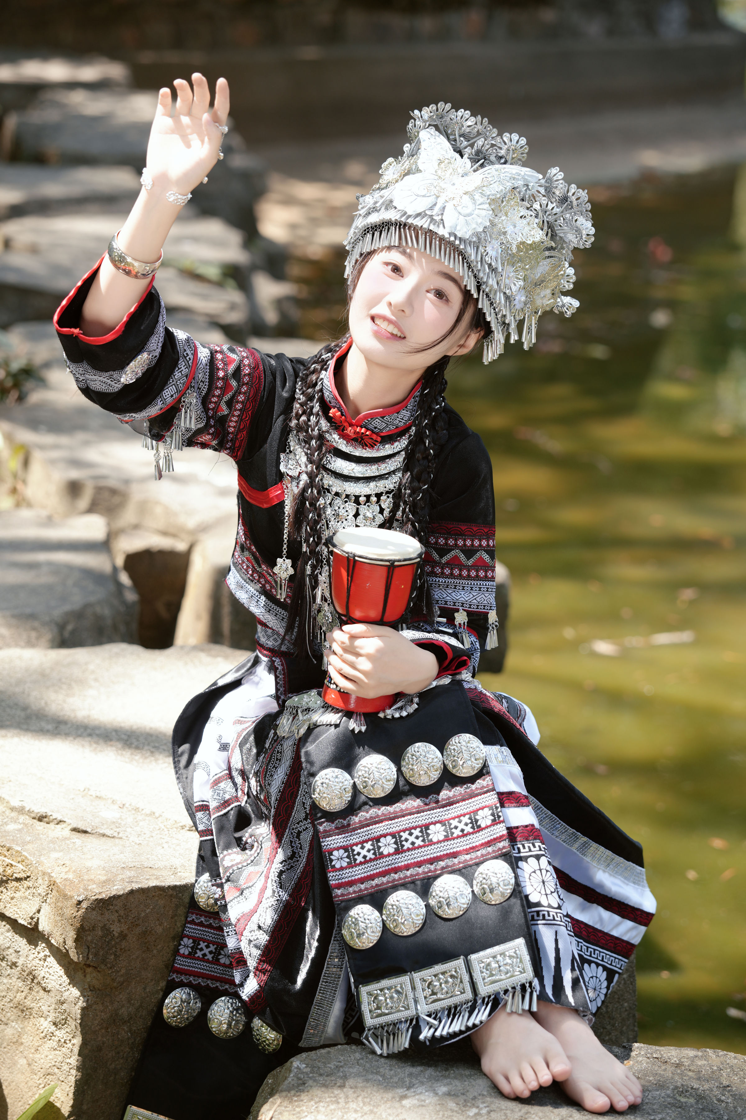 Miao woman in traditional embroidered dress