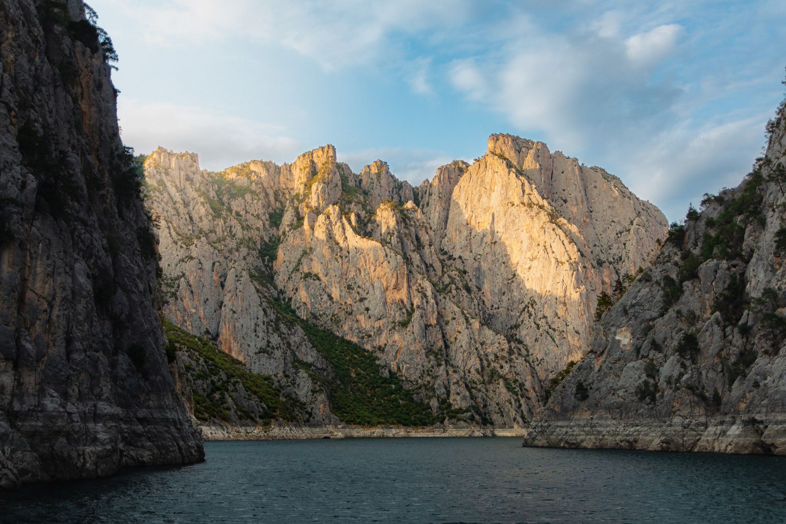 Mountain peak rising above a misty lake